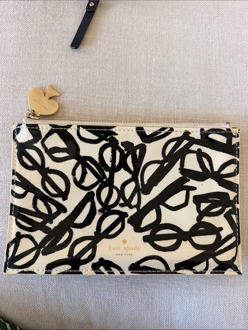 kate spade Cream and Black Abstract Zip Pouch with Gold Logo Charm
